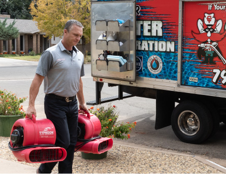 Technician carrying air blowers